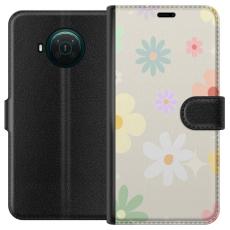 iSecrets - Plånboksfodral till Nokia X20 med fejdande blommor