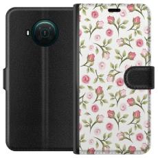 iSecrets - Pl&aring;nboksfodral till Nokia X20 med Blommigt