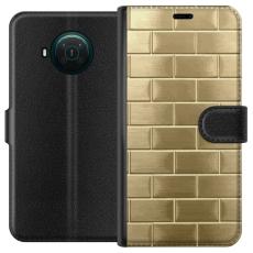 iSecrets - Pl&aring;nboksfodral till Nokia X20 med Gyllene Murstenar